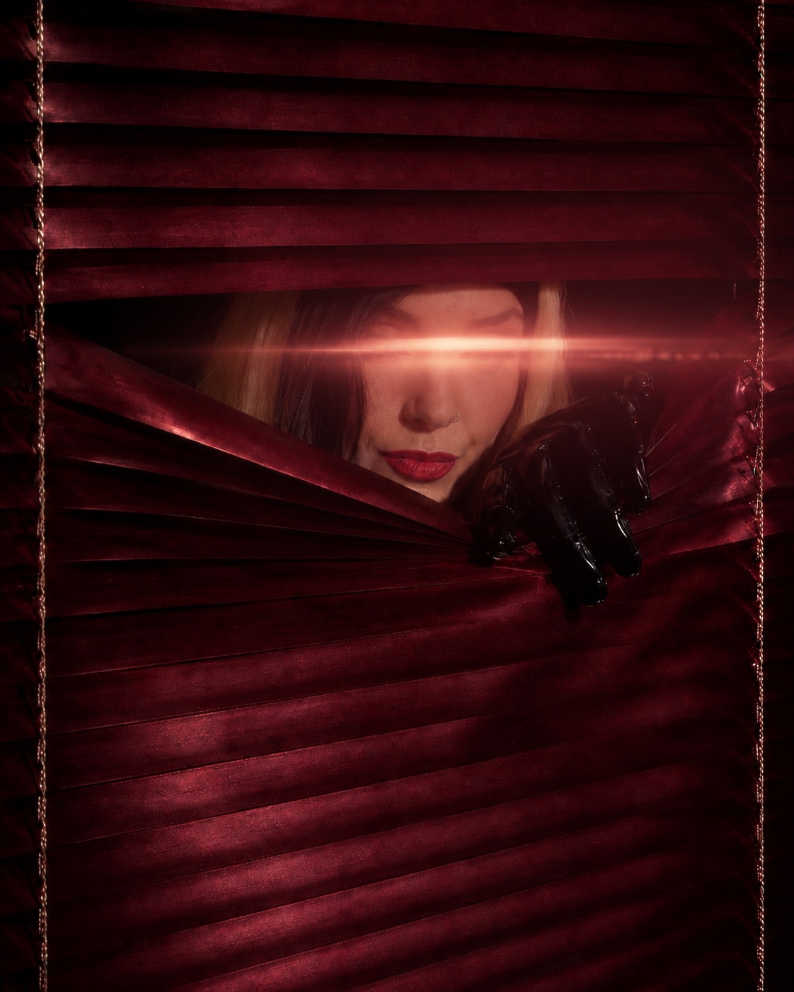 Aria behind red venetian blinds, a band of light across her eyes.